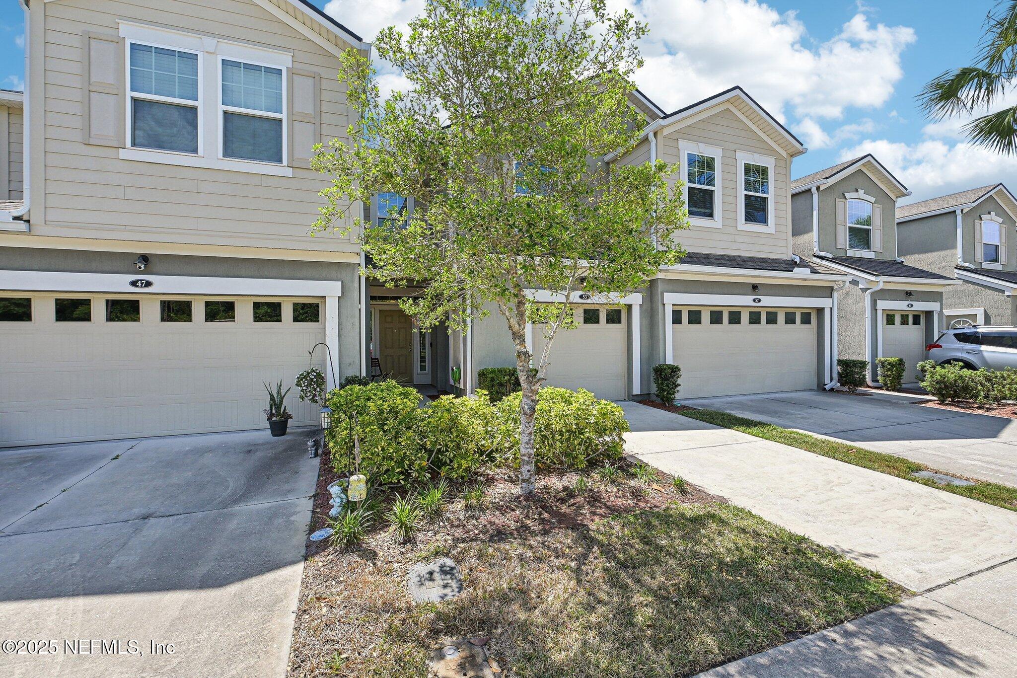 53 Nelson Lane St. Johns, FL 32259 - Photo 9 of 37 a front view of a house with garden