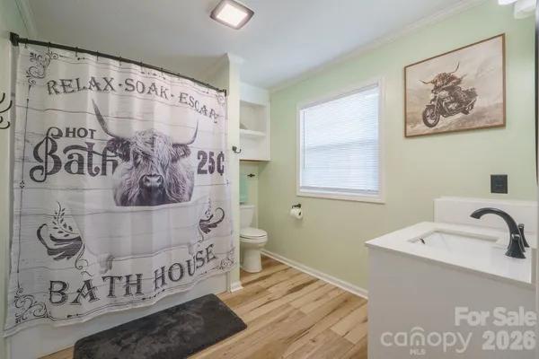a bathroom with a bathtub and shower