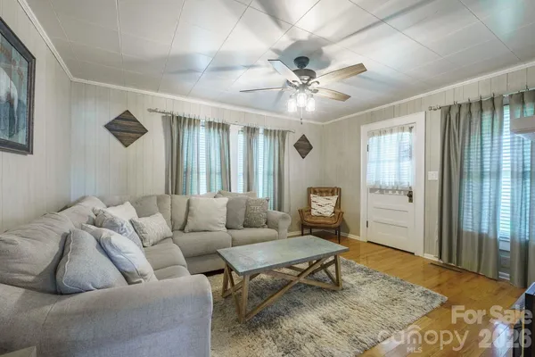 a living room with furniture and a rug