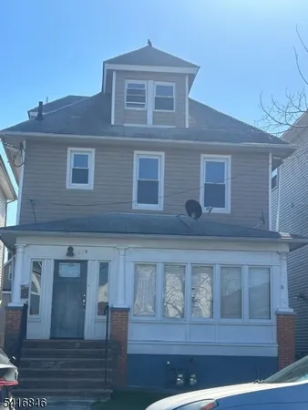 a front view of a house with balcony