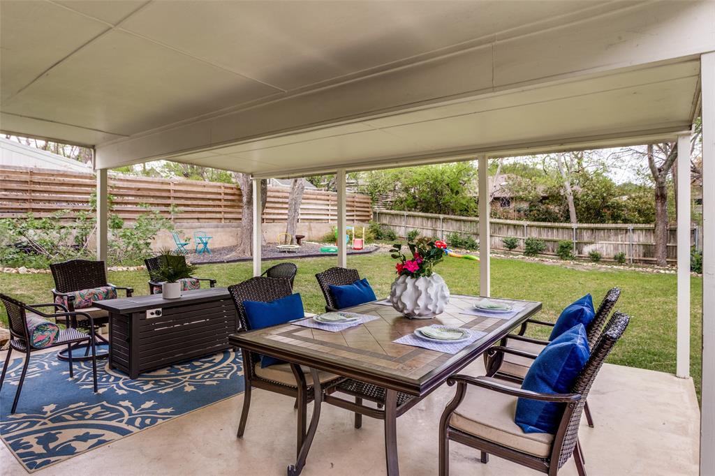 6491 Kirkwood Road Fort Worth, TX 76116 - Photo 23 of 25 a view of a dining room with furniture large windows and wooden floor