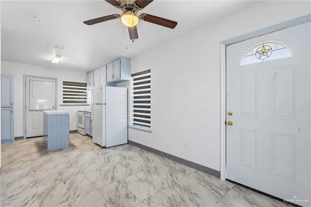 a view of a kitchen with a sink and dishwasher