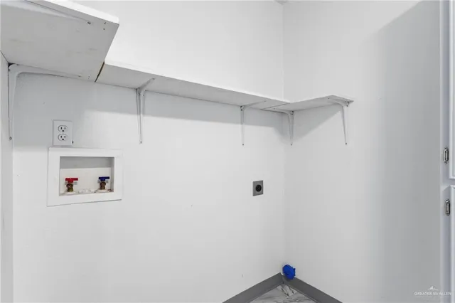 a room with a white cabinet and a white wall