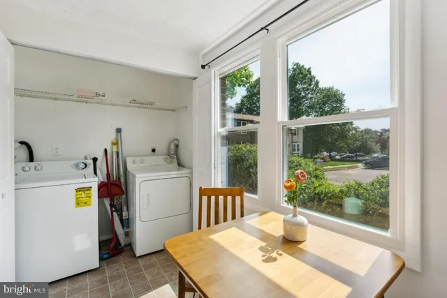 a view of a kitchen and workspace