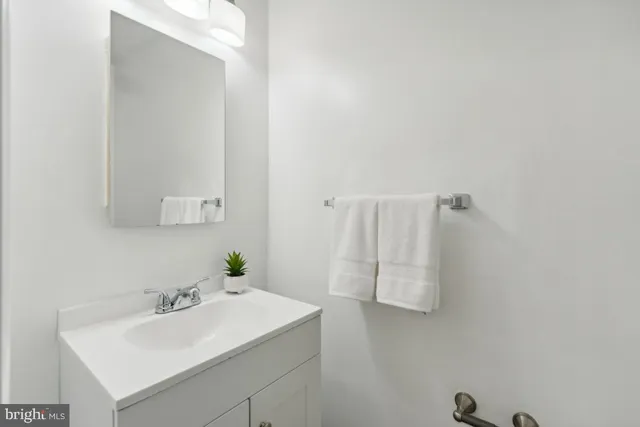 a bathroom with a sink and mirror