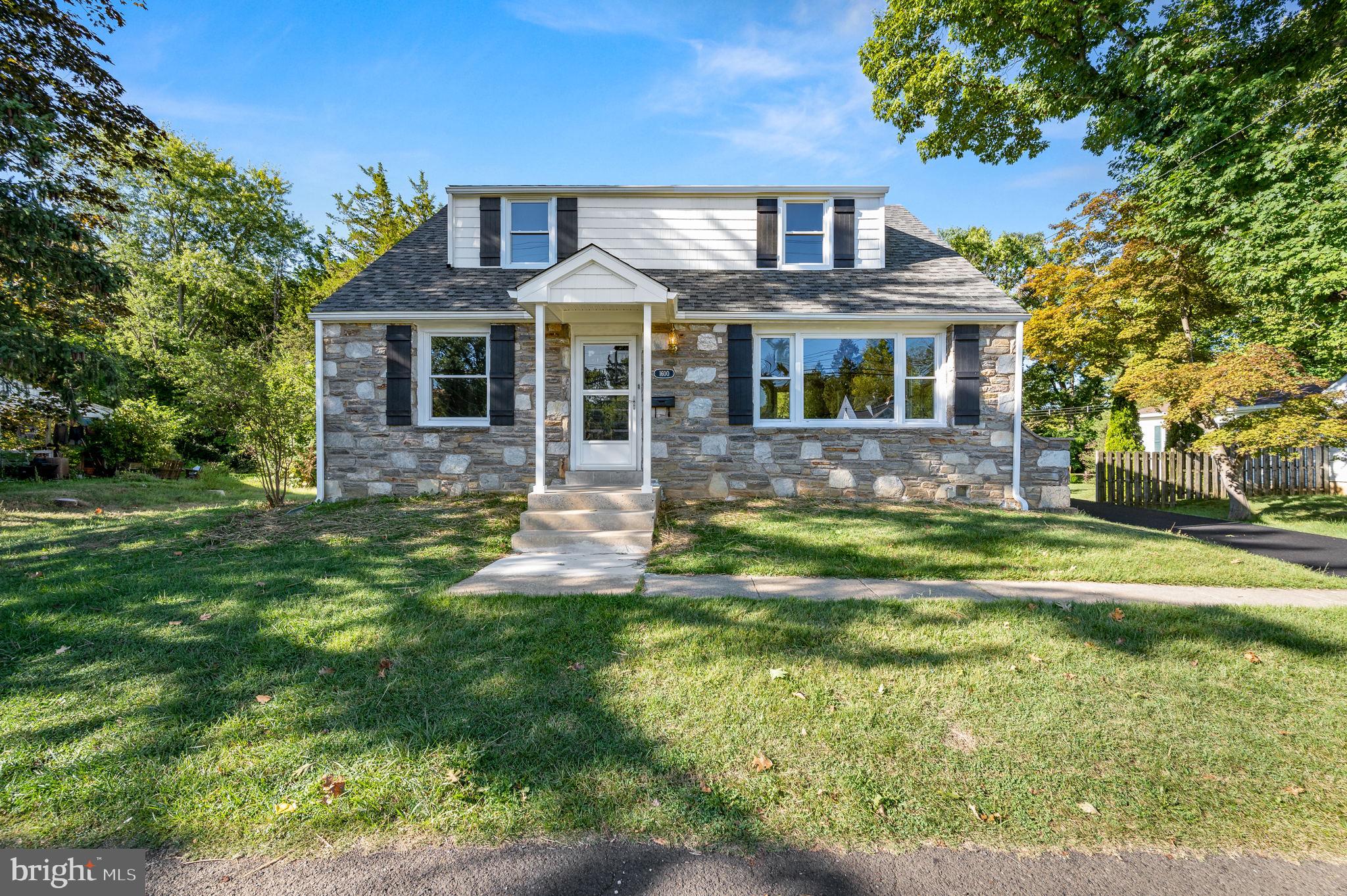 1600 Church Road Oreland, PA 19075 - Photo 1 of 22 a front view of a house with a yard