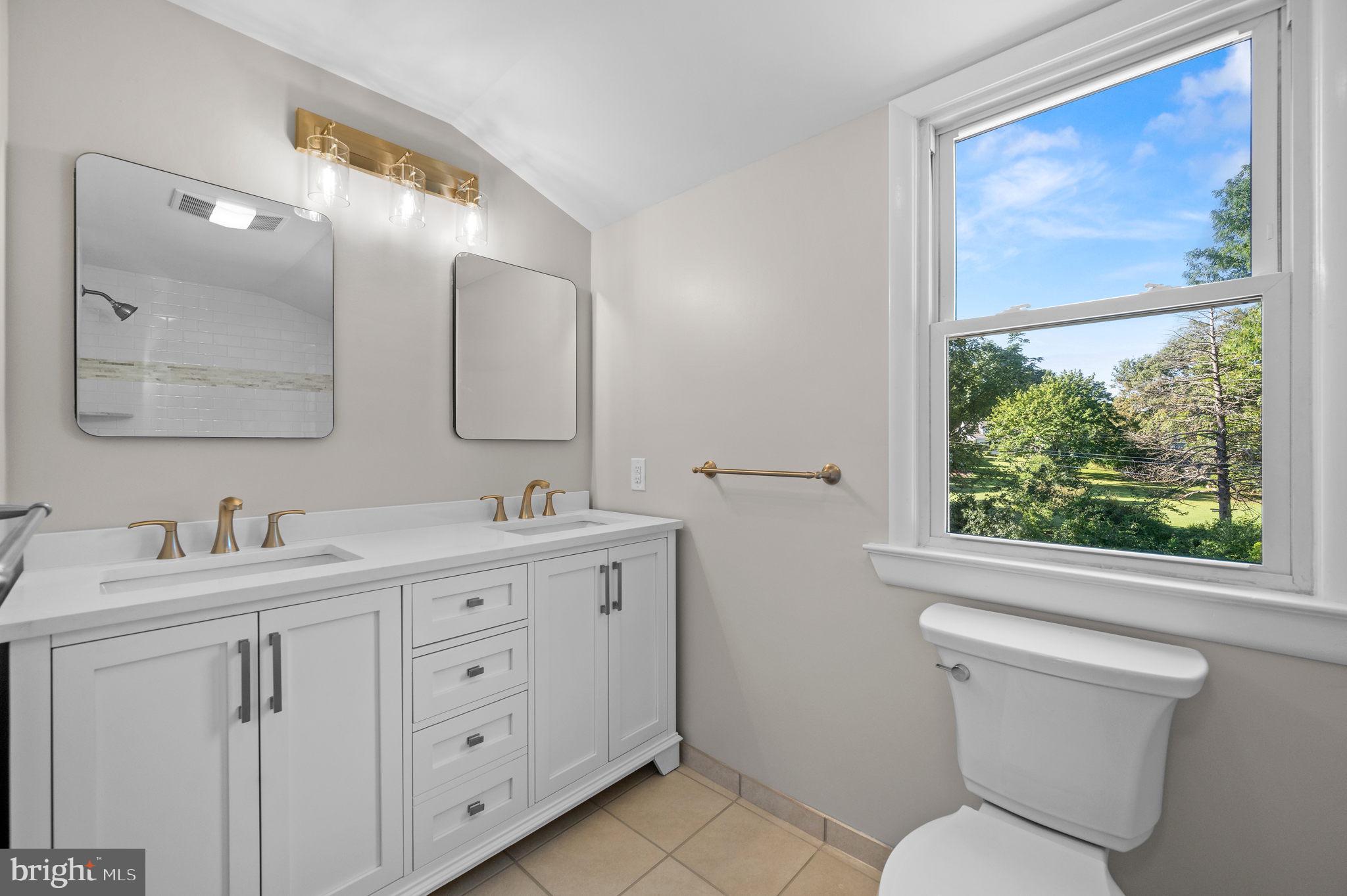 1600 Church Road Oreland, PA 19075 - Photo 17 of 22 a bathroom with a toilet sink and mirror