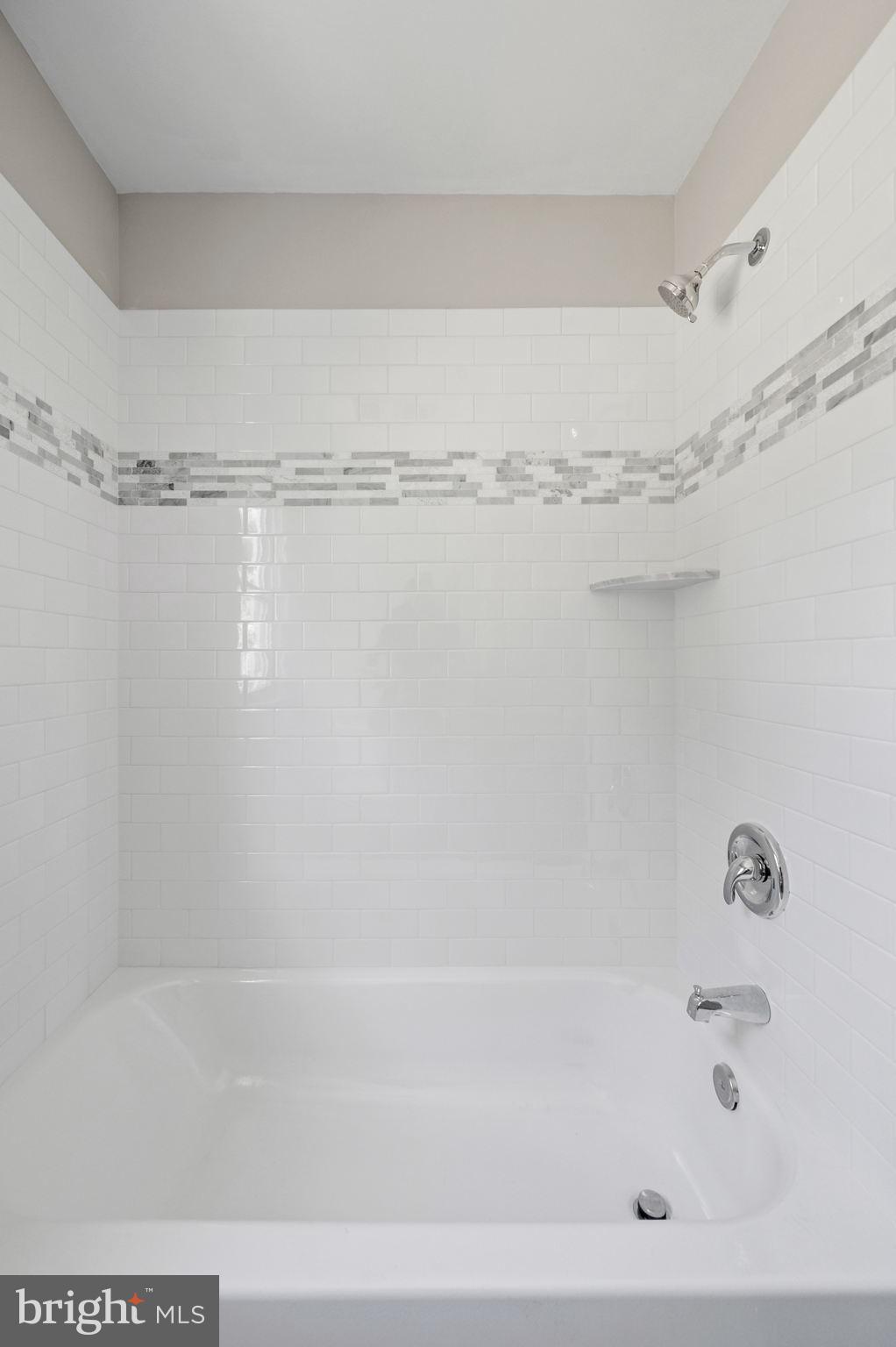1600 Church Road Oreland, PA 19075 - Photo 10 of 22 a bathroom with a shower and a bath tub