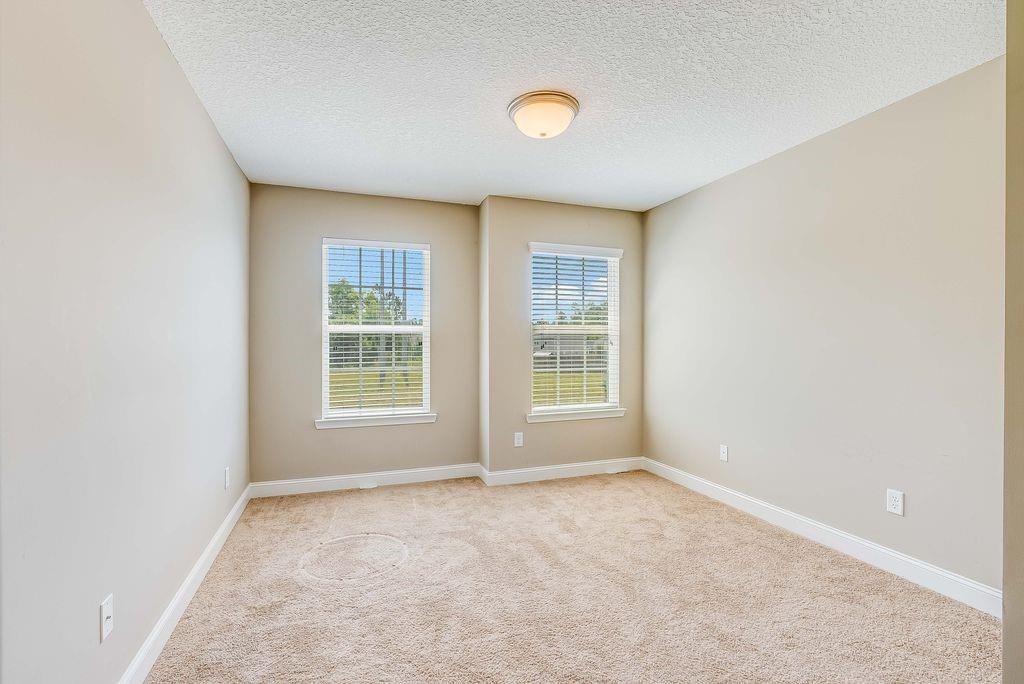 1200 Cypress Fall Circle Hinesville, GA 31313 - Photo 11 of 24 an empty room with windows