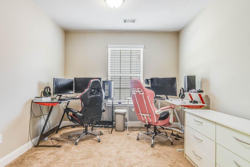1200 Cypress Fall Circle Hinesville, GA 31313 - Photo 16 of 24 a view of a workspace with furniture and a window