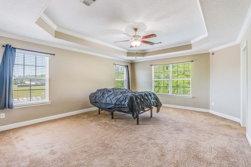 1200 Cypress Fall Circle Hinesville, GA 31313 - Photo 20 of 24 a bedroom with a bed and a window