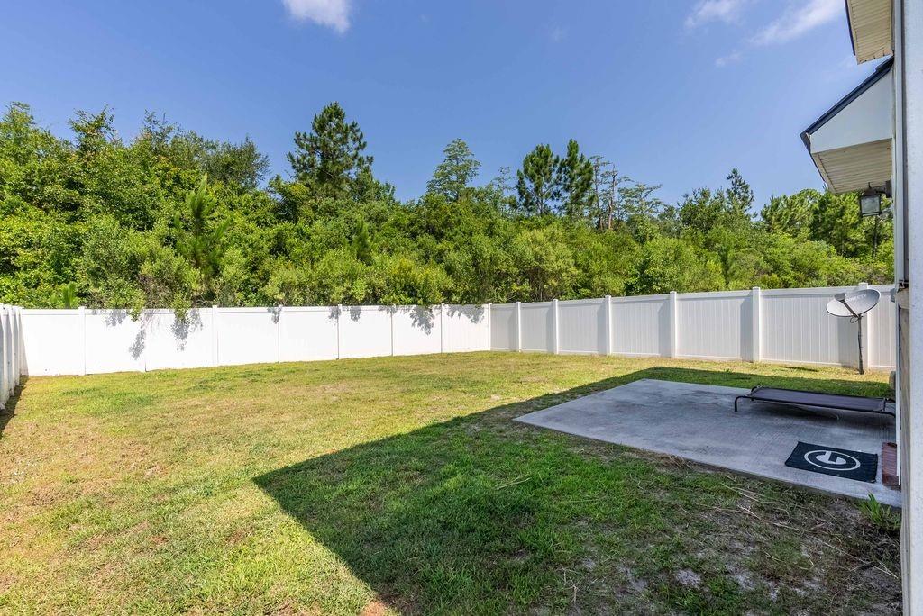 1200 Cypress Fall Circle Hinesville, GA 31313 - Photo 23 of 24 a view of a backyard