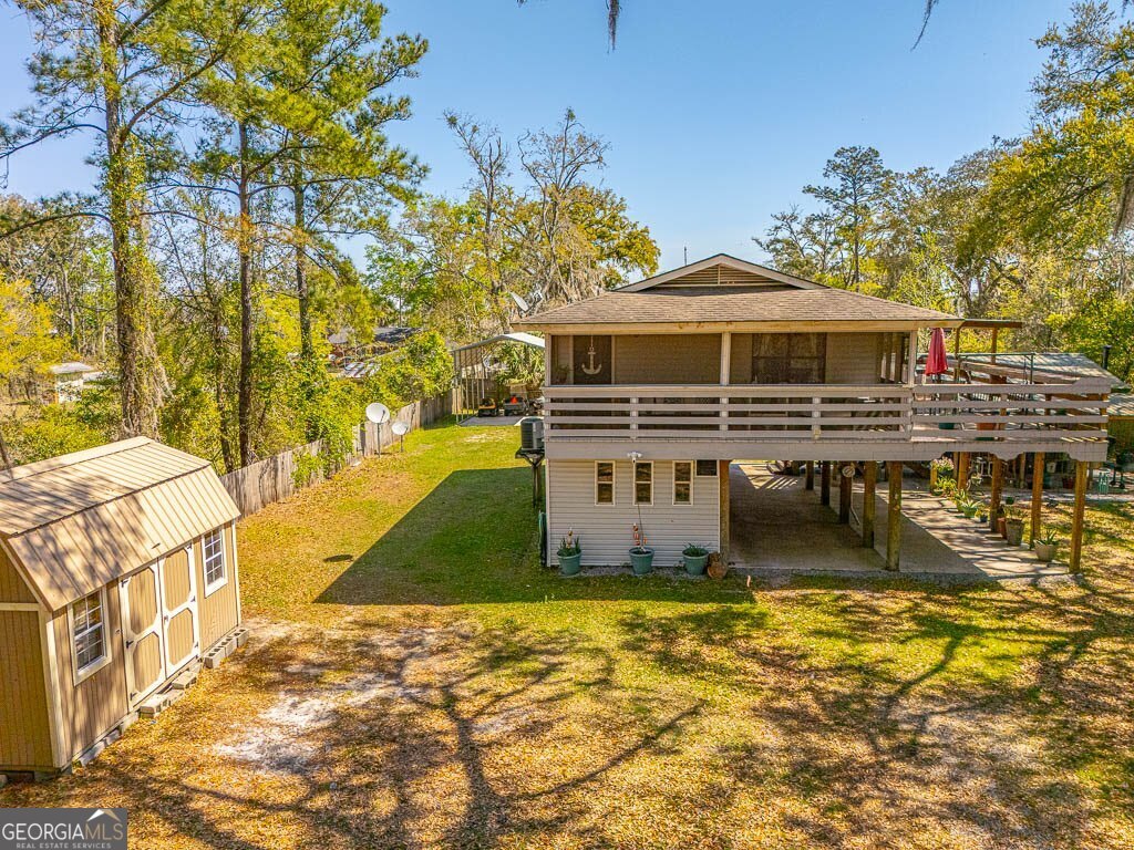 33 Warren Avenue Waverly, GA 31565 - Photo 60 of 63 a front view of a house with swimming pool
