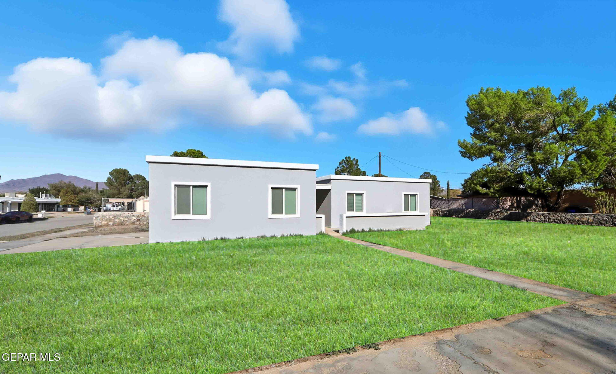 a house view with a garden space