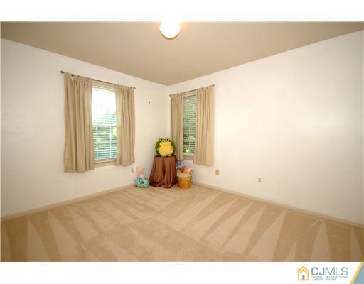 3801 Springbrook Drive Edison, NJ 08820 - Photo 11 of 13 a bed room with a bed