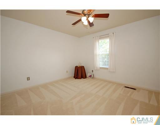 3801 Springbrook Drive Edison, NJ 08820 - Photo 12 of 13 a view of a room with a ceiling fan and window