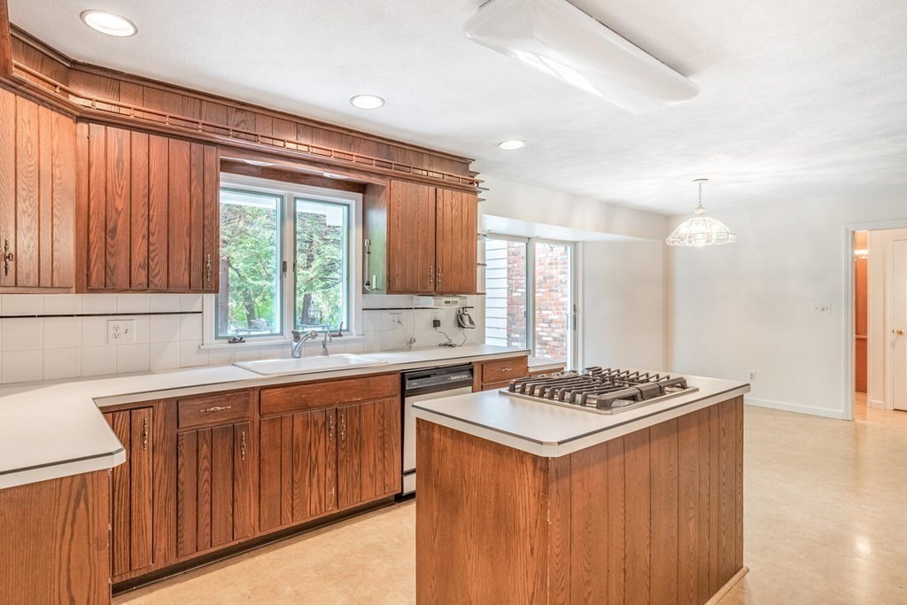 116 Kendall Road Lexington, MA 02421 - Photo 14 of 28 a kitchen that has a sink and a stove in it