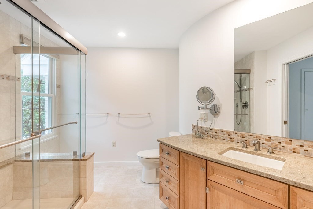 116 Kendall Road Lexington, MA 02421 - Photo 20 of 28 a bathroom with a double vanity sink mirror and toilet