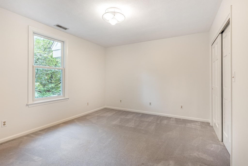 116 Kendall Road Lexington, MA 02421 - Photo 23 of 28 an empty room with a window