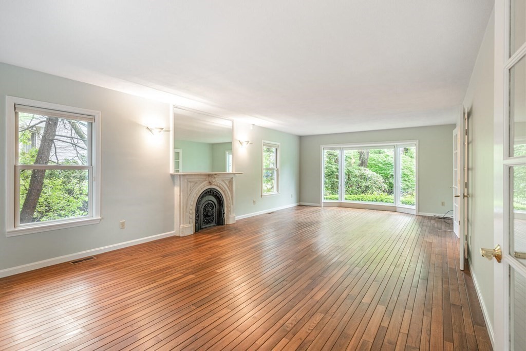 116 Kendall Road Lexington, MA 02421 - Photo 4 of 28 an empty room with wooden floor and windows