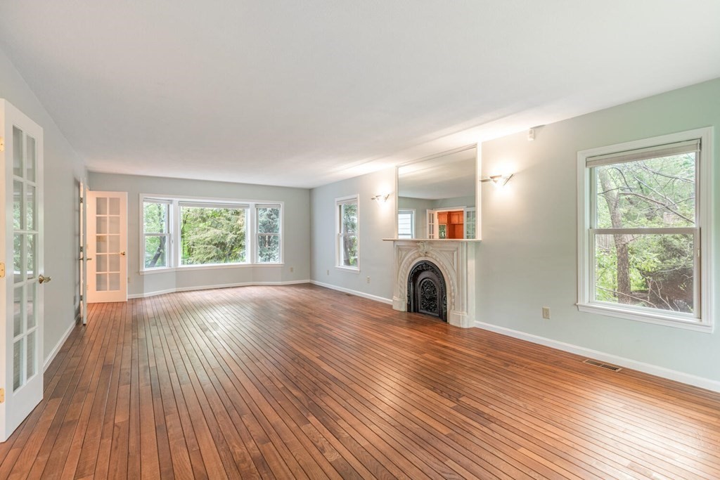 116 Kendall Road Lexington, MA 02421 - Photo 6 of 28 a view of a livingroom with furniture a fireplace and wooden floor