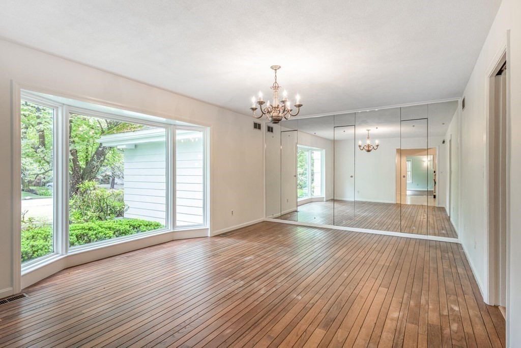 116 Kendall Road Lexington, MA 02421 - Photo 9 of 28 a view of a room with wooden floor and large window
