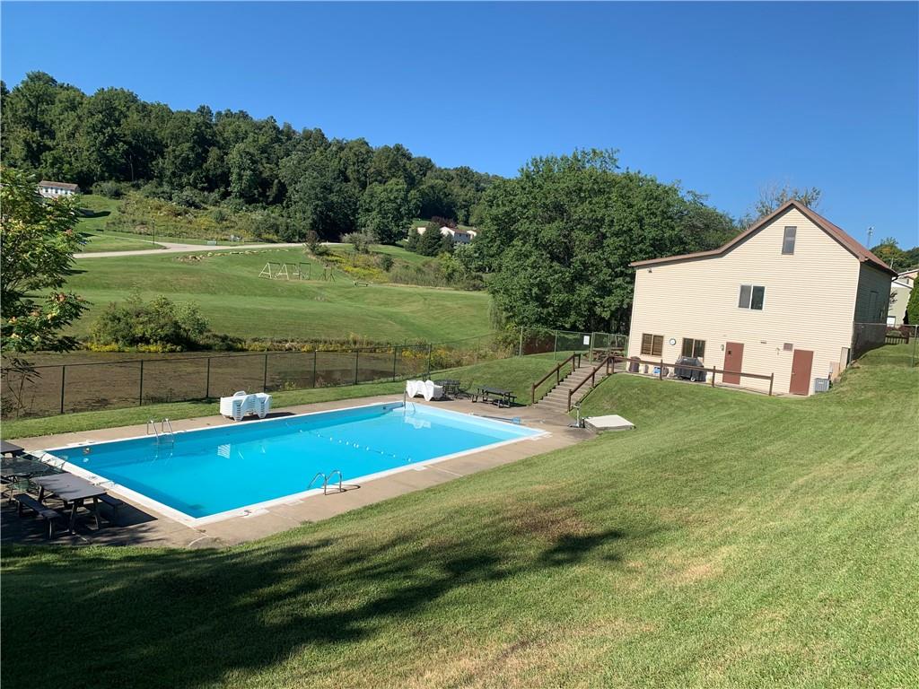 320 Sugar Maple Circle Washington, PA 15301 - Photo 17 of 23 a view of a house with pool and a yard