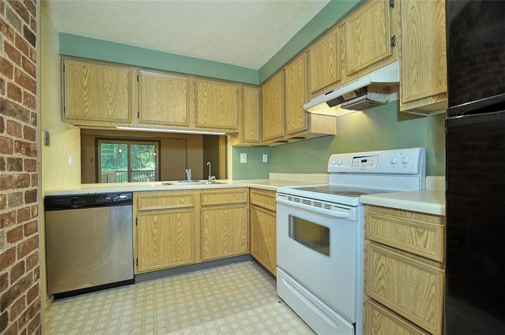320 Sugar Maple Circle Washington, PA 15301 - Photo 3 of 23 a kitchen with a stove a sink and a refrigerator