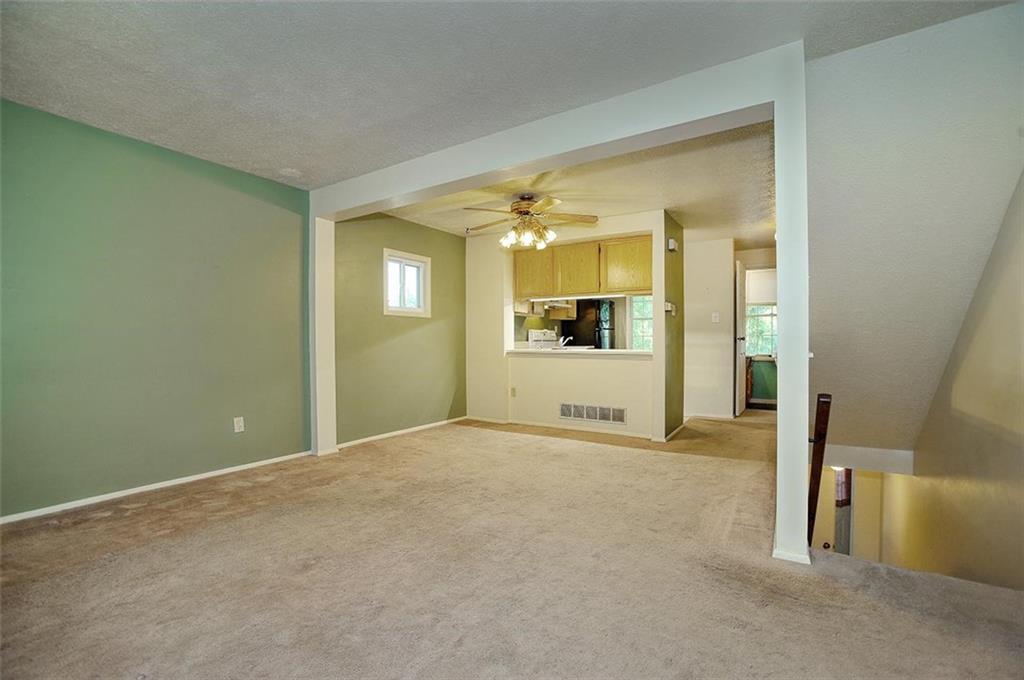 320 Sugar Maple Circle Washington, PA 15301 - Photo 6 of 23 a view of a big room with wooden floor and a kitchen