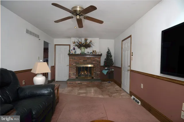 a bathroom with a toilet and a rug