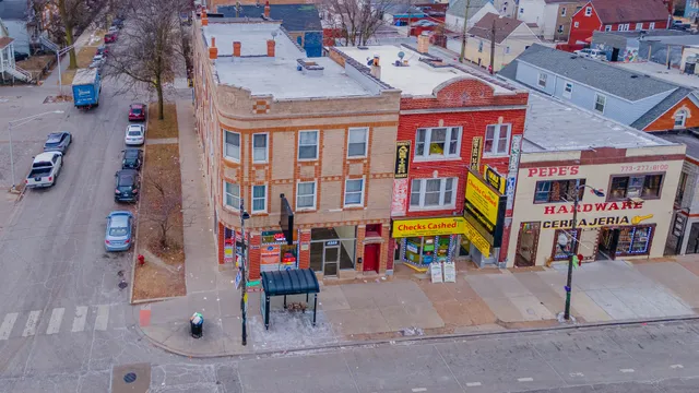 an aerial view of residential houses with outdoor space
