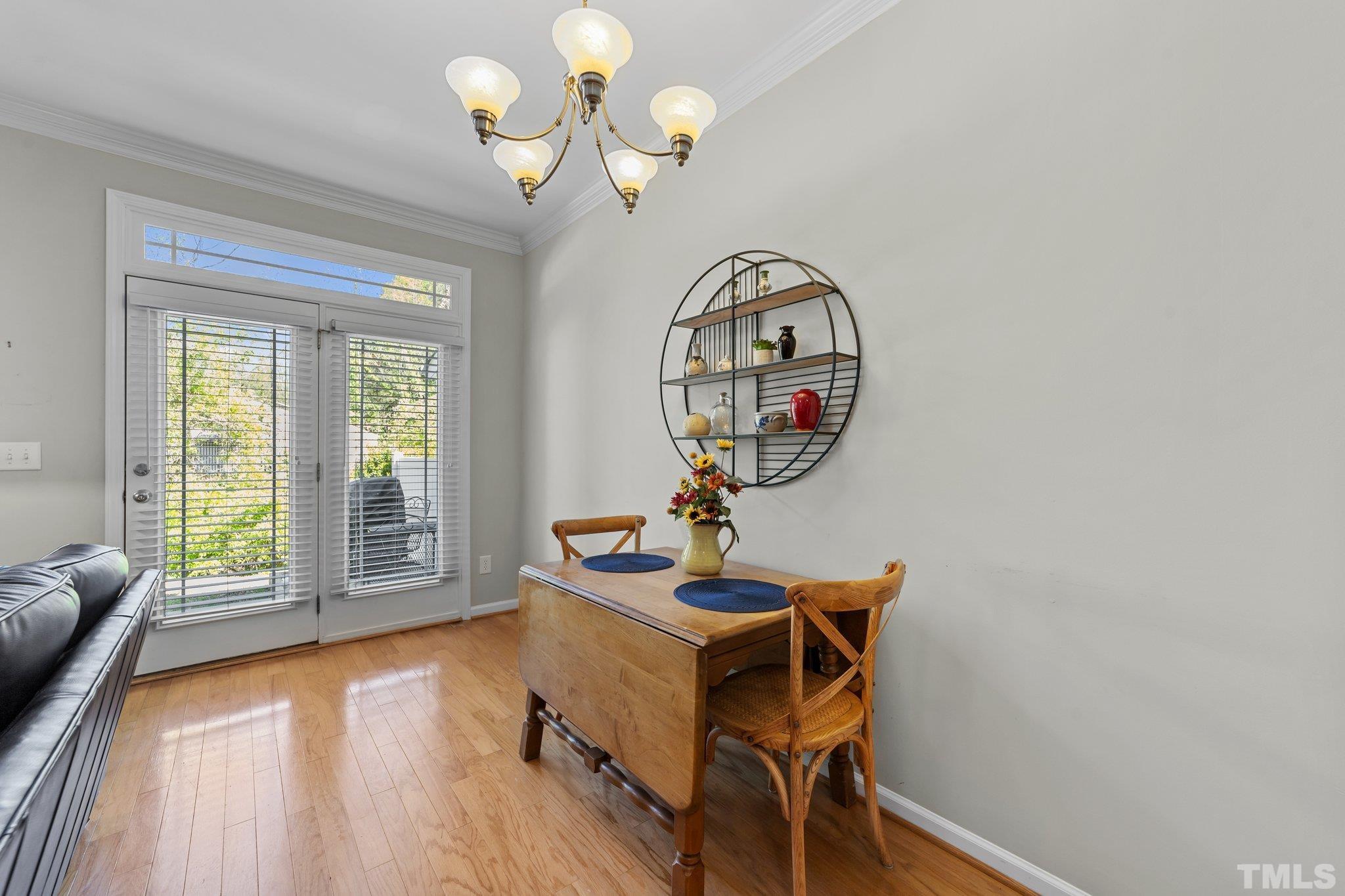 4728 Altha Street Raleigh, NC 27606 - Photo 13 of 31 a view of a livingroom with furniture wooden floor and windows