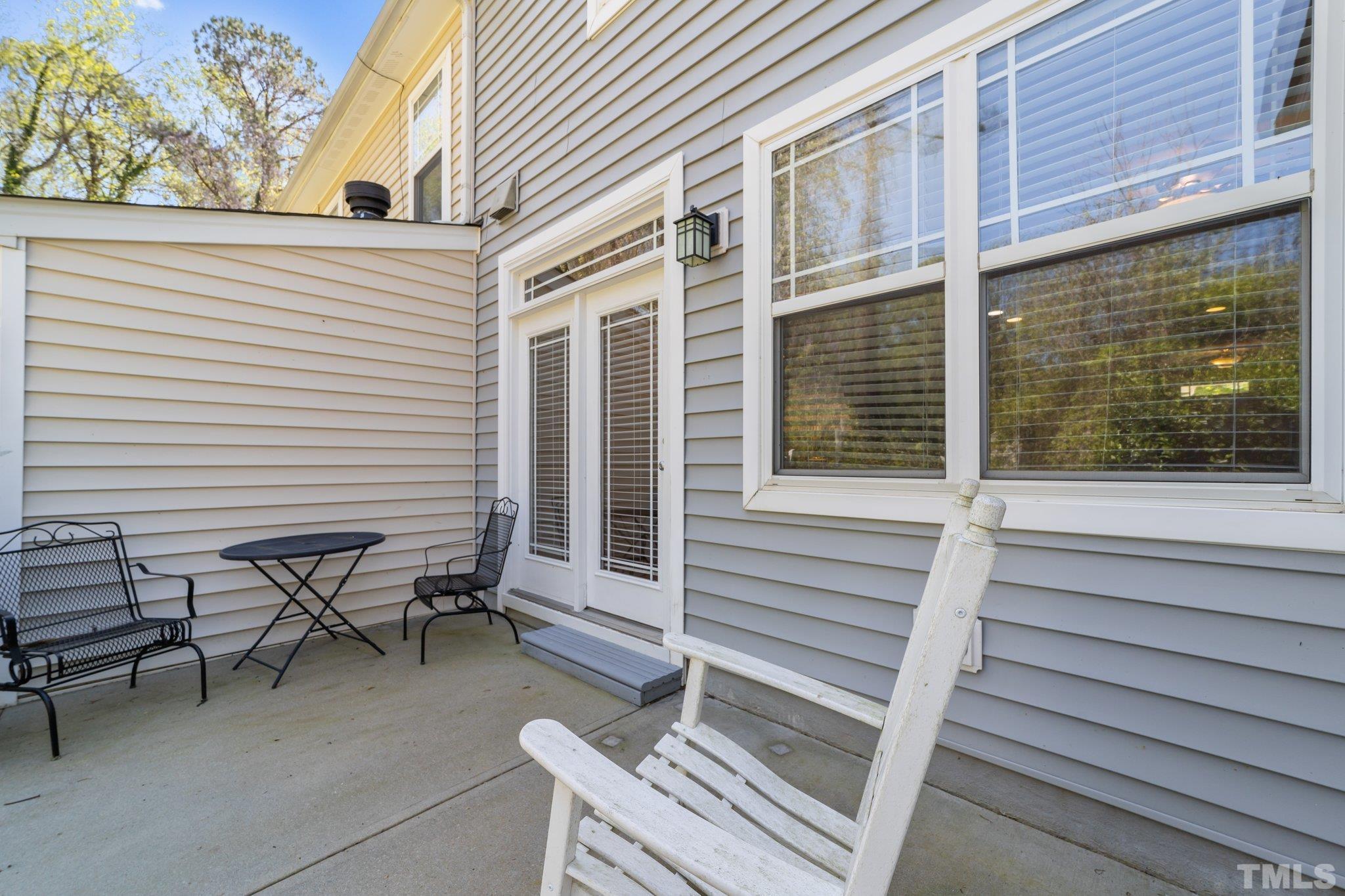 4728 Altha Street Raleigh, NC 27606 - Photo 15 of 31 a view of a house with a table and chair