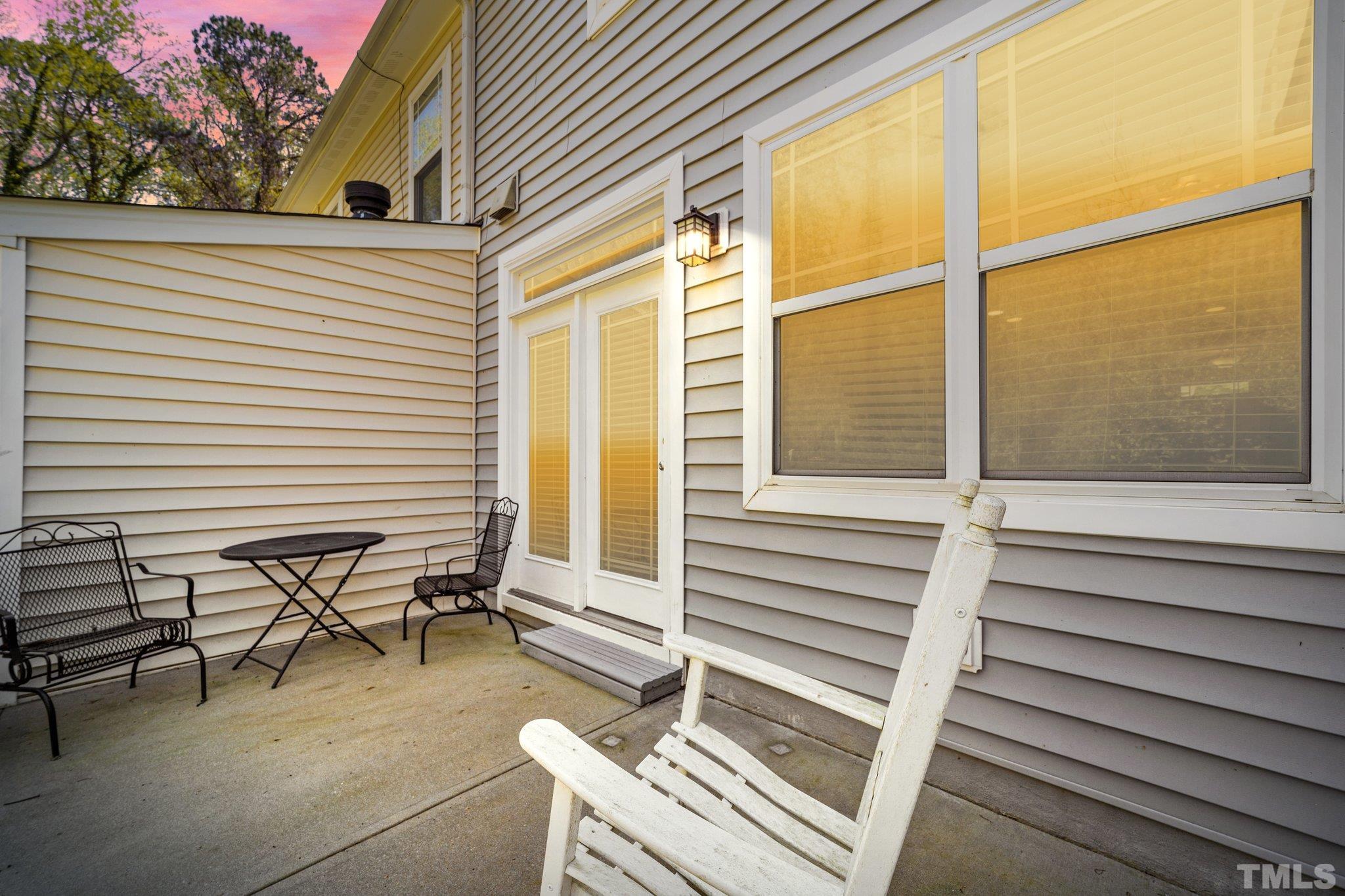 4728 Altha Street Raleigh, NC 27606 - Photo 2 of 31 a view of a patio with table and chairs and wooden floor