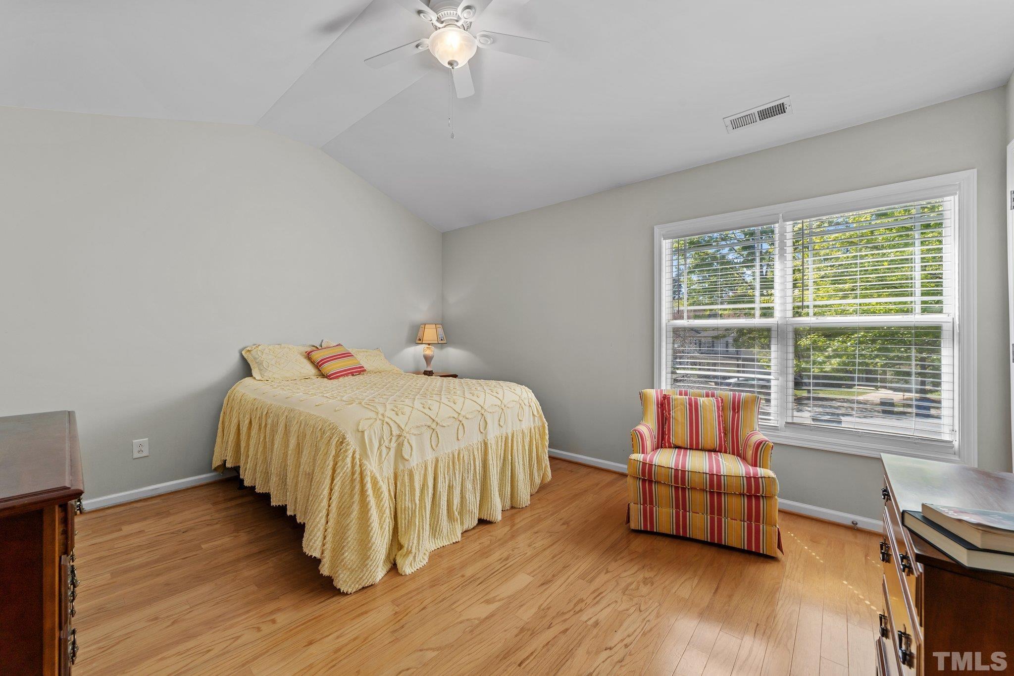 4728 Altha Street Raleigh, NC 27606 - Photo 23 of 31 a bedroom with a bed and a large window