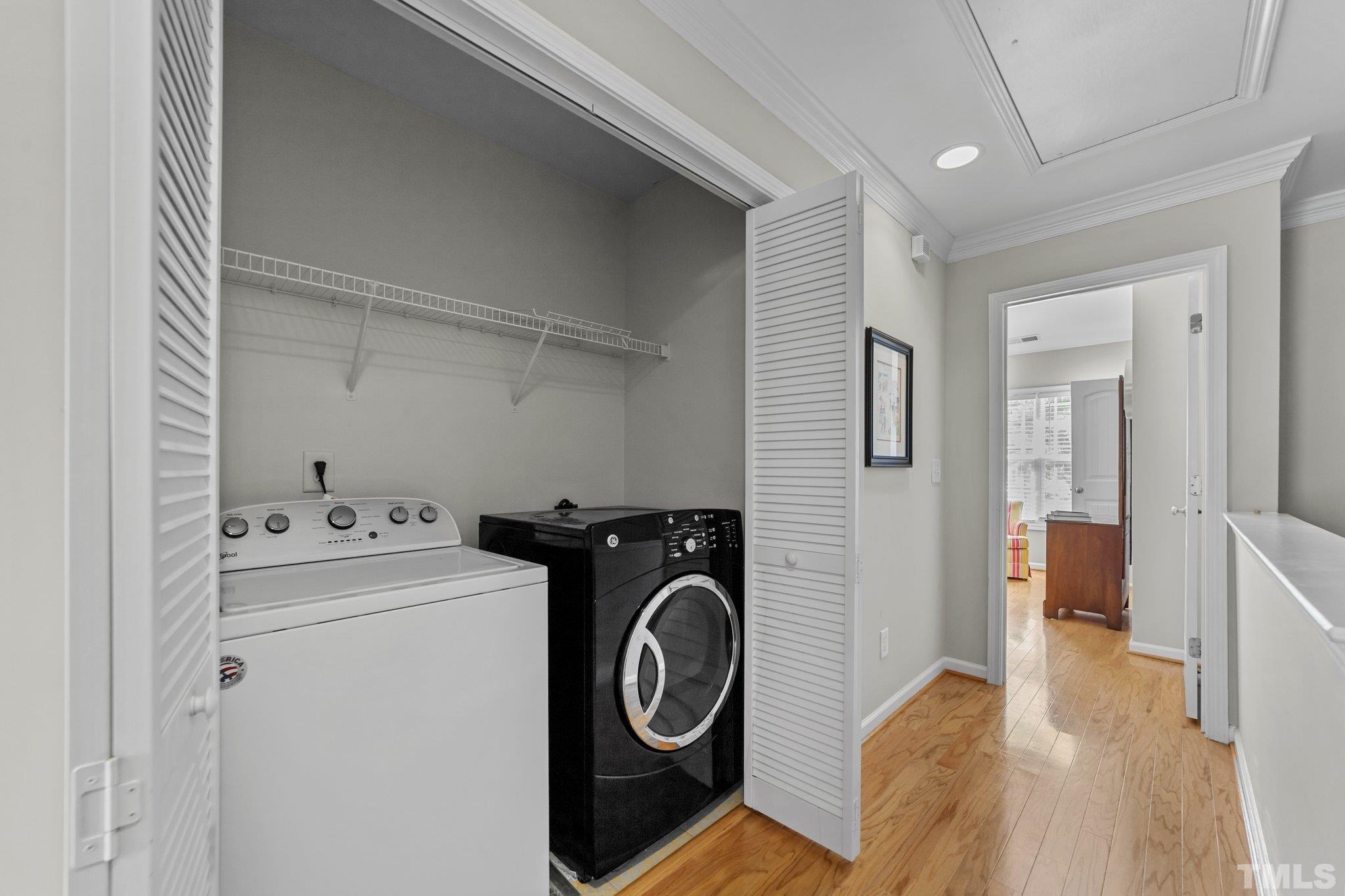 4728 Altha Street Raleigh, NC 27606 - Photo 28 of 31 a view of storage and utility room with washer and dryer