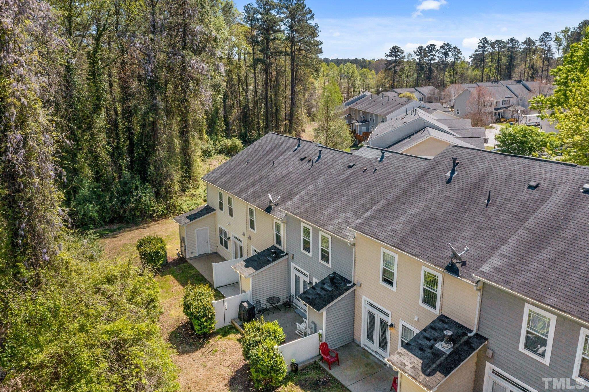 4728 Altha Street Raleigh, NC 27606 - Photo 30 of 31 an aerial view of multiple houses with yard