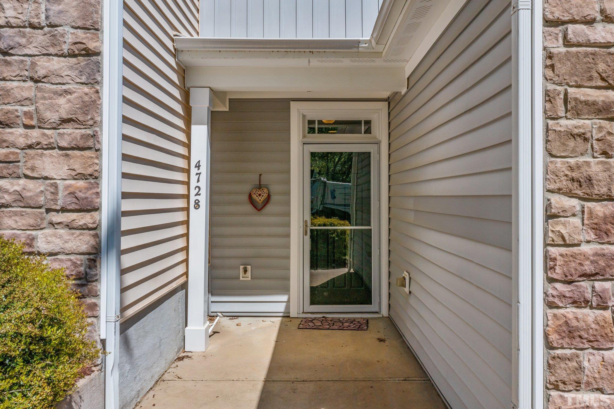 4728 Altha Street Raleigh, NC 27606 - Photo 3 of 31 a view of a door and a window