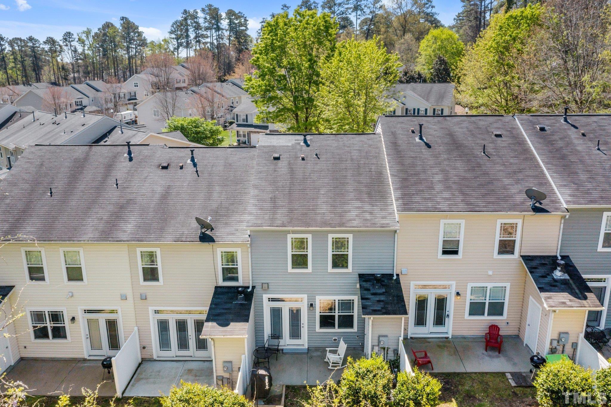 4728 Altha Street Raleigh, NC 27606 - Photo 31 of 31 an aerial view of multiple houses with a yard