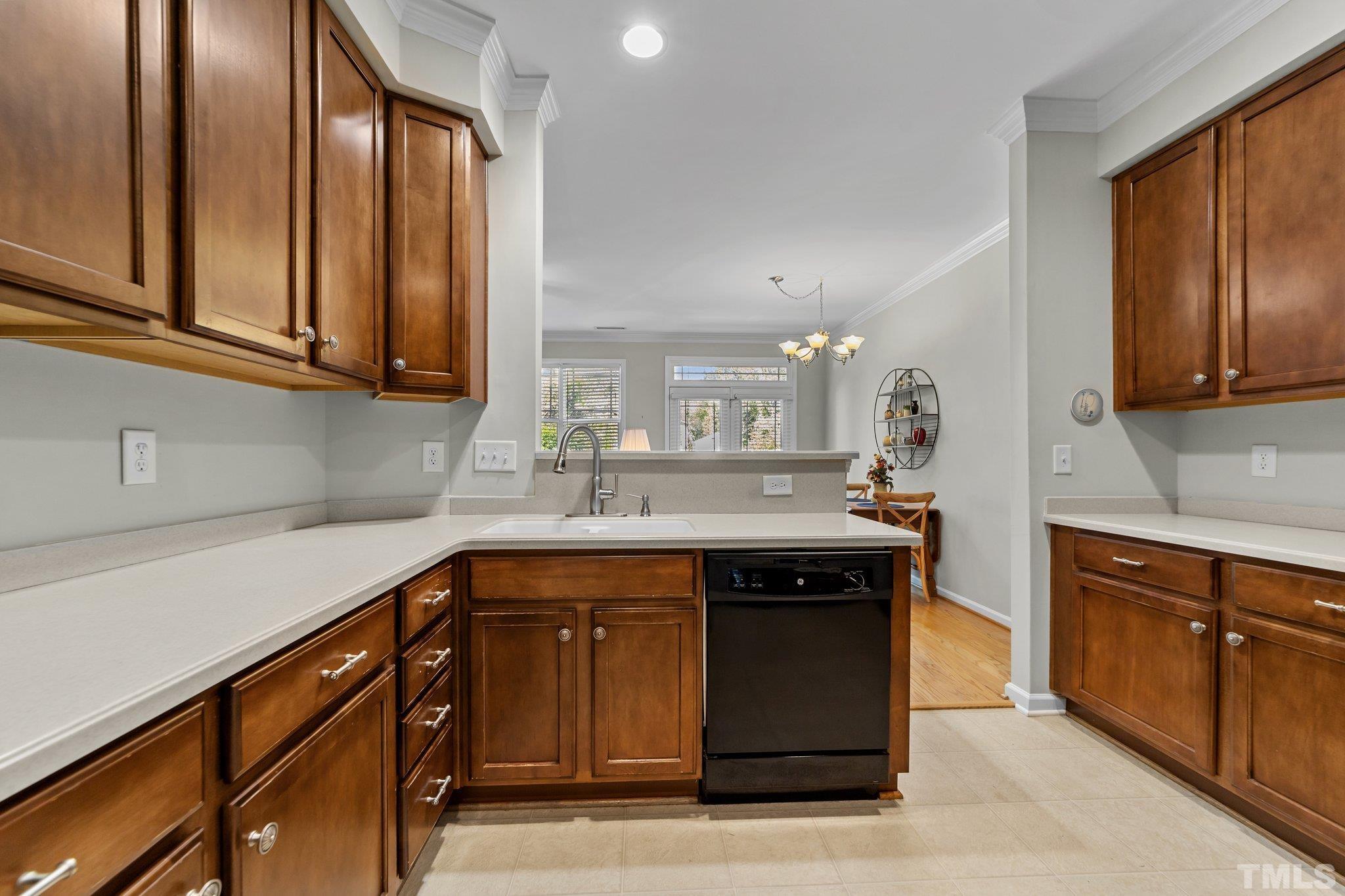 4728 Altha Street Raleigh, NC 27606 - Photo 8 of 31 a kitchen with stainless steel appliances granite countertop a sink and cabinets
