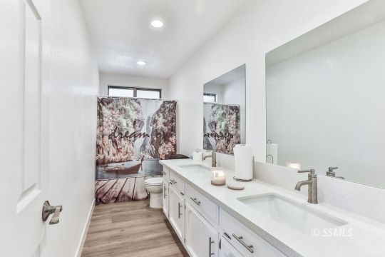 832 Walker Lane Ridgecrest, CA 93555 - Photo 14 of 23 a spacious bathroom with double vanity and a shower