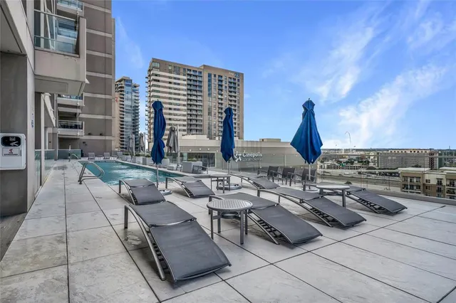 a view of terrace with seating space and building view