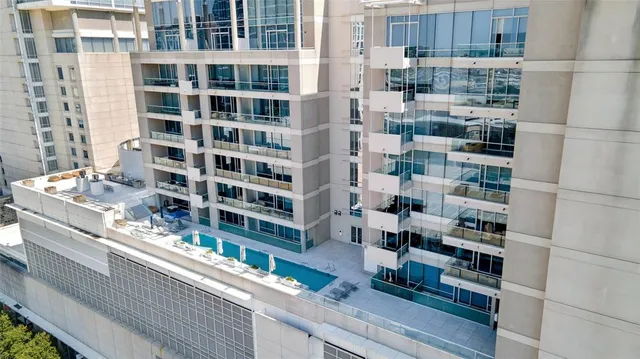 a view of a tall building from a balcony