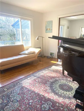 a bedroom with a bed window and a couch