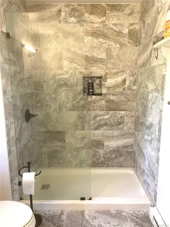 a kitchen with a dining table chairs and chandelier