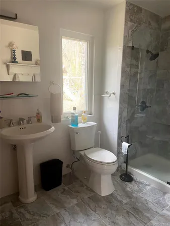 a living room with couch and a window