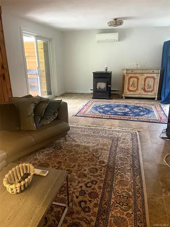 a view of a room with wooden floor and a chair
