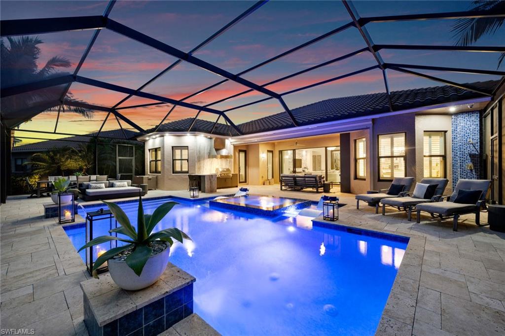 4353 Caldera Circle Naples, FL 34119 - Photo 1 of 40 a living room with furniture a dining table and chairs with a table