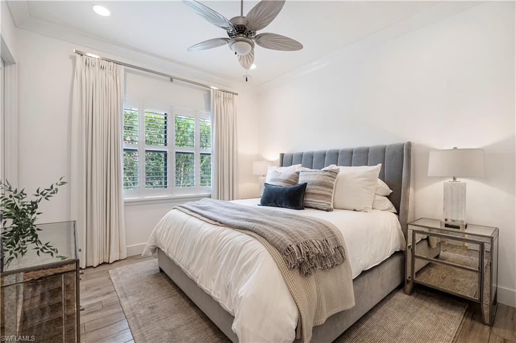 4353 Caldera Circle Naples, FL 34119 - Photo 18 of 40 a bed room with a bed and a window