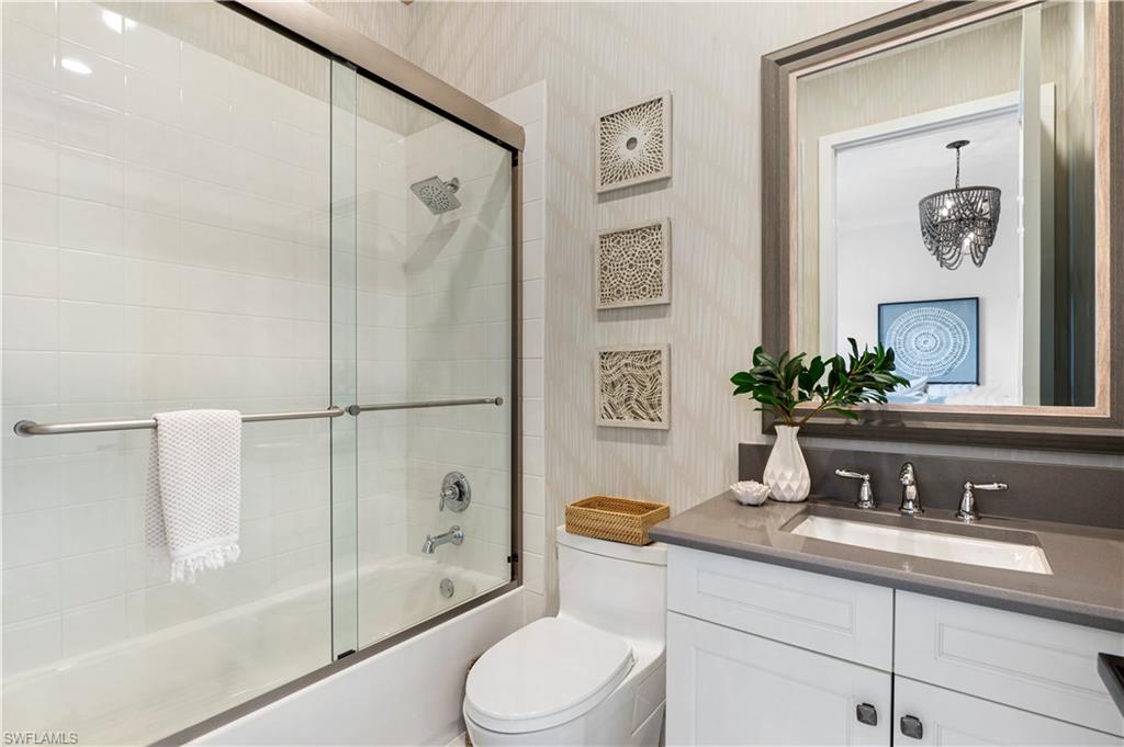 4353 Caldera Circle Naples, FL 34119 - Photo 21 of 40 a bathroom with a sink a toilet and shower